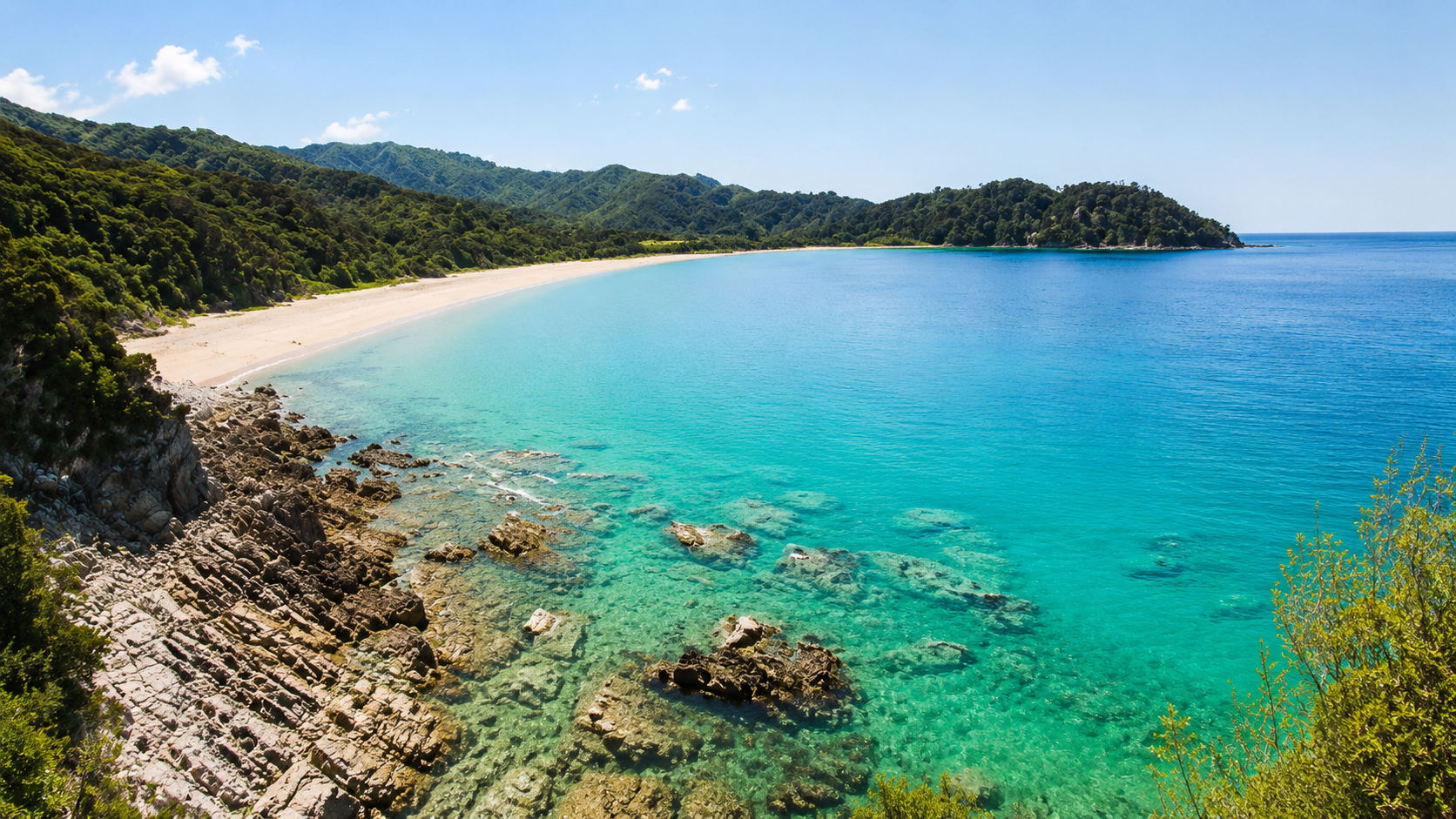 Sweeping turquoise bay and white sand beach in the Abel Tasman